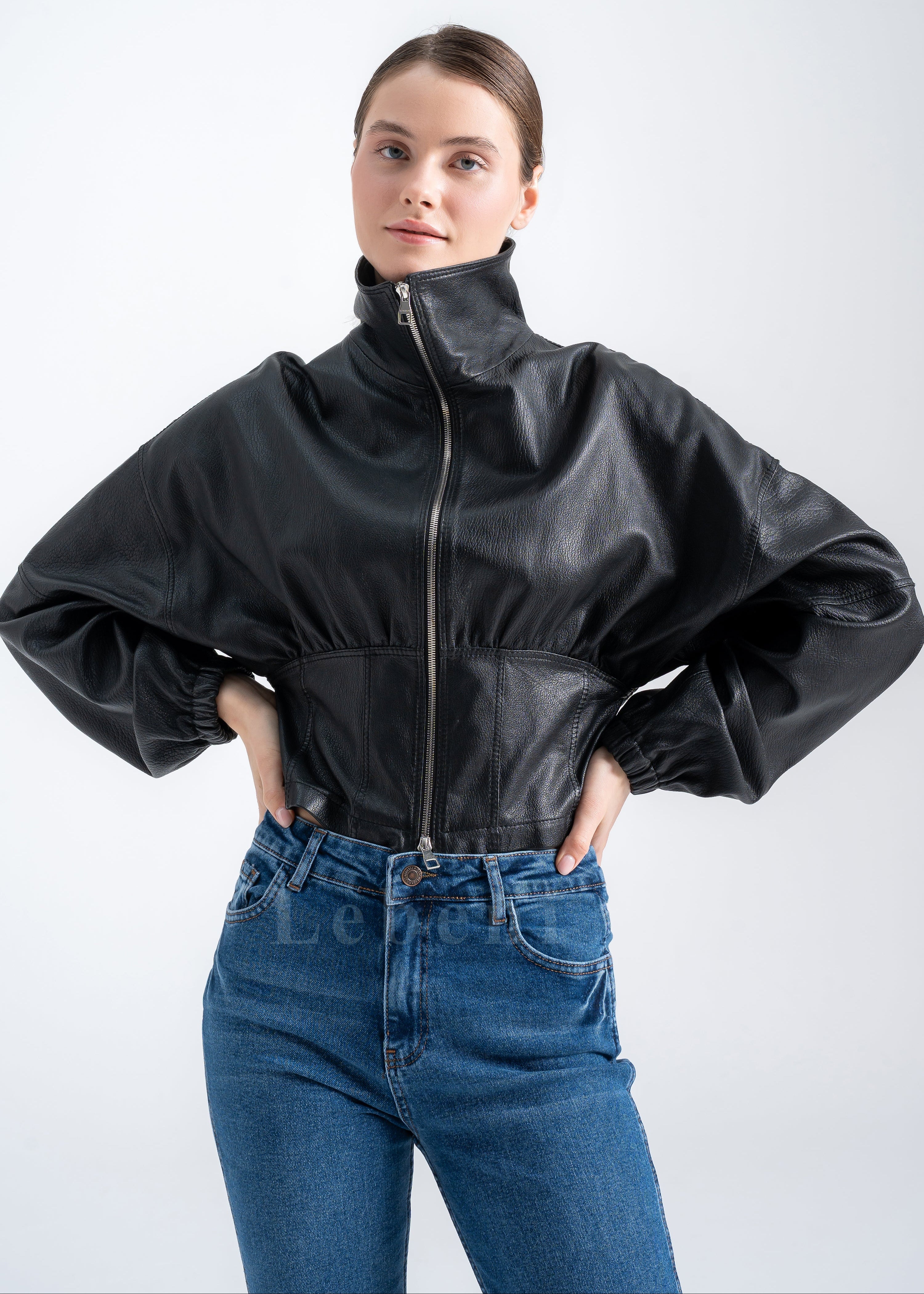 Black lambskin cropped jacket with balloon sleeves and two-way zipper, collar down, front view.