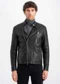 Man wearing a black lambskin biker jacket with asymmetrical zipper, snap-tab collar, and silver hardware by Lebeni.