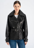 Woman wearing a black croco embossed lambskin leather jacket with wide collar, asymmetric zipper, waist belt, cuff straps and moto style pockets by Lebeni.